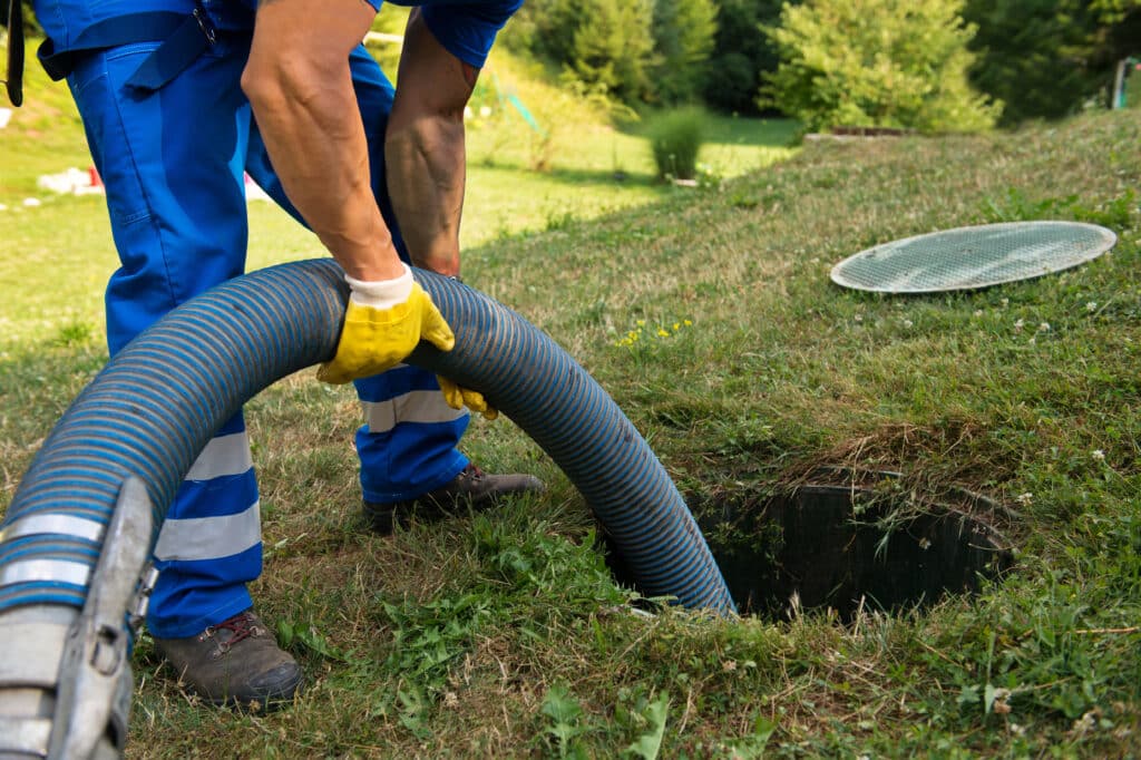 Emptying household septic tank. Cleaning sludge from septic syst